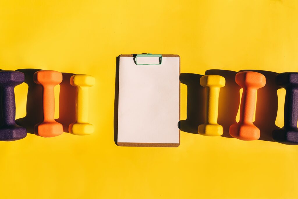 Clip board with hand weights for weight loss